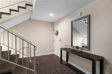 Entry hallway and front door to unit.