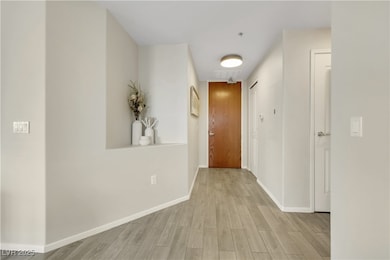Corridor featuring wood like porcelain flooring