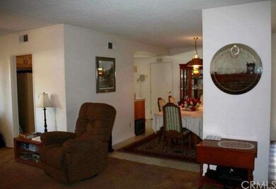 Looking to dining room from living room. Kitchen a