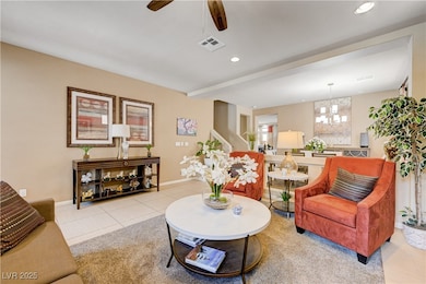 Living room featuring a ceiling fan, recessed ligh