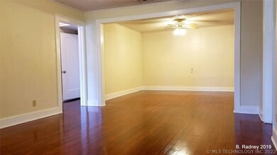 Original hardwood floors are a focal feature of th