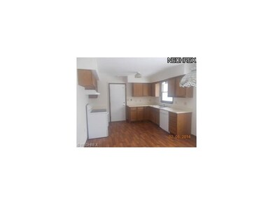 modern kitchen with stove and hood, ample counter 