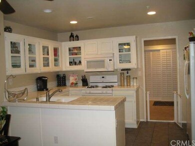 OPEN KITCHEN LEADING INTO THE FAMILY ROOM
