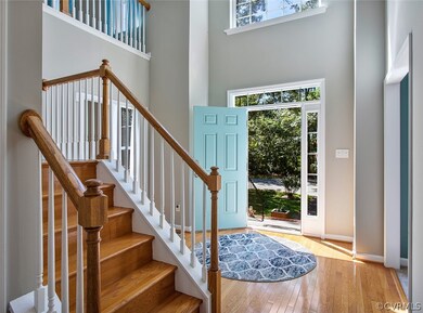 2 story entry foyer, hardwood floors.
