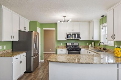 Granite countertops and breakfast bar.