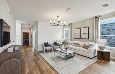 Open concept gathering room creating a spacious and inviting atmosphere *Model representation
