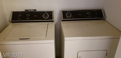 Laundry room with washer and clothes dryer
