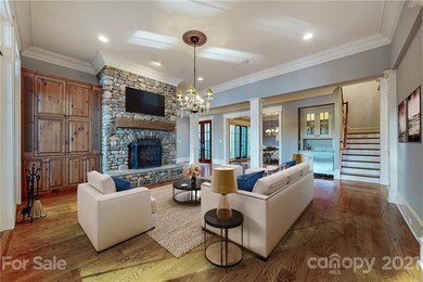 Open great room with gorgeous stone accented firep