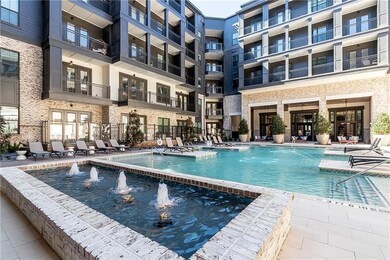 View of swimming pool with a patio and pool water 