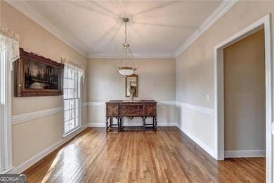 Unfurnished formal dining area featuring baseboard