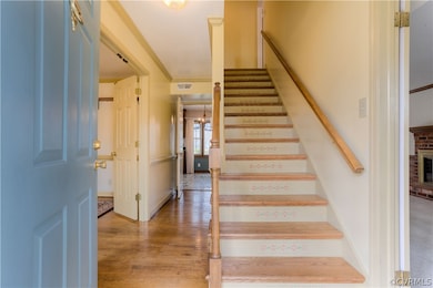 Foyer with hardwood flooring and new oak steps to the second level!