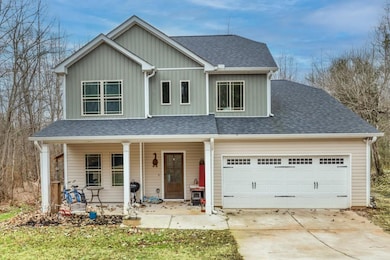 Traditional-style house featuring covered porch, c