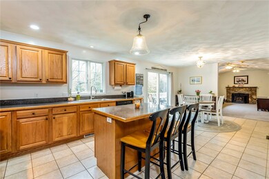 Eat in Kitchen with wooden cabinetry and Stainless
