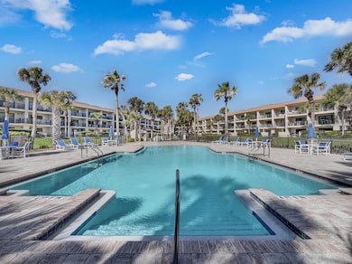 Community pool with a patio area