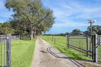An automatic , solar-powered, driveway gate and ou