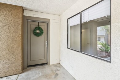 Doorway to property with stucco siding