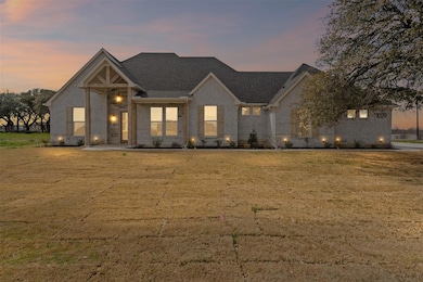 View of front of property with brick siding and a 