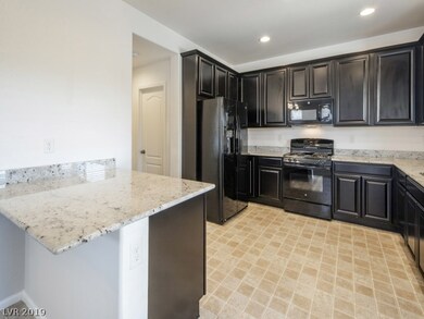 Kitchen opens to family room, featuring breakfast