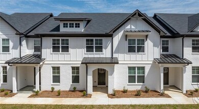 Multi unit property featuring a standing seam roof, board and batten siding, brick siding, and metal roof