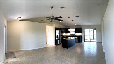 KITCHEN AND DINING ROOM WITH SLIDING GLASS DOORS O