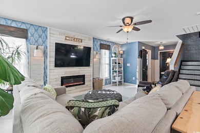 Living room featuring a textured ceiling, ceiling 
