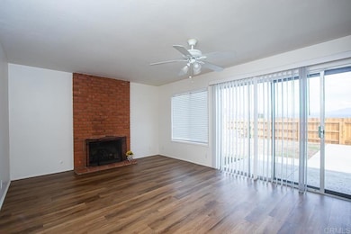 Has fireplace and sliding doors to pool area.