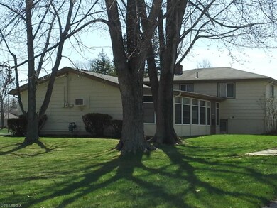 Looking South West at yard and enclosed patio with