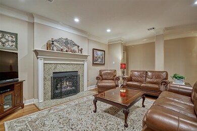 Crown molding throughout, lots of recess lighting and neutral colors.