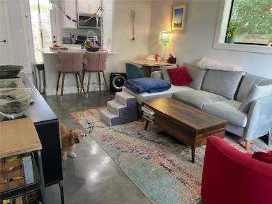 Living room with finished concrete floors