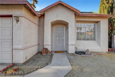 View of exterior entry with stucco siding