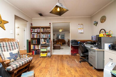 Living room featuring carpet floors, a textured ce