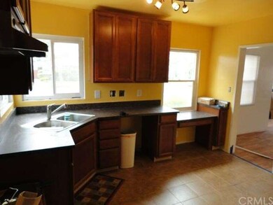 Remodeled kitchen with new cabinets and flooring