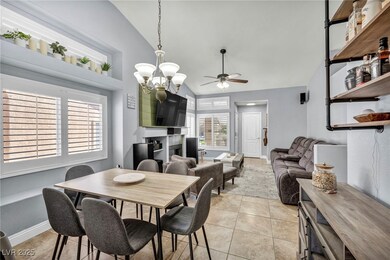 Dining space with light tile patterned floors, bas