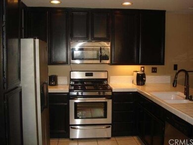 Step-saver kitchen with stainless steel gas stove,