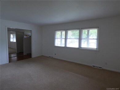 View of living room back towards the front door.  