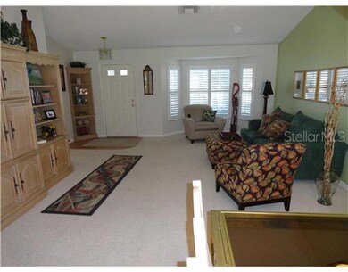 Living Room - Living room with plantation shutters and cathedral ceiling.