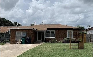 Back of house featuring a lawn
