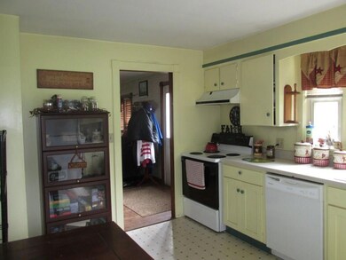 The entry way leads in to the living...