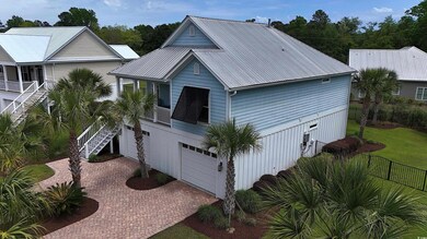 View of front of home featuring decorative drivewa