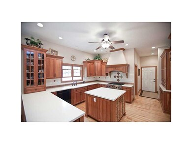 Kitchen. Cherry cabinets and Corian countertops