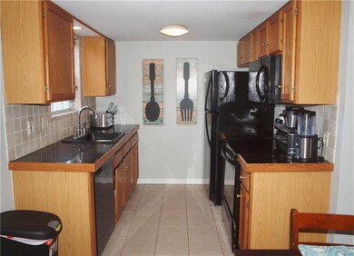 Nicely updated kitchen with tile flooring and back