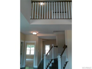 Grand entry in to the foyer that features a volume
