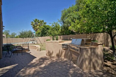 Built in BBQ, firepit, and grassy yard