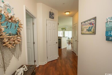 Corridor with dark hardwood / wood-style floors