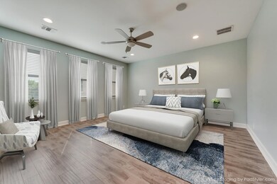 Bedroom with light wood finished floors, a ceiling fan, and recessed lighting