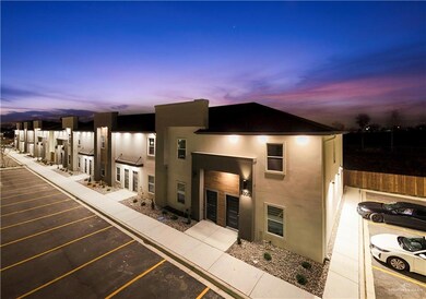 View of front of home with uncovered parking and stucco siding