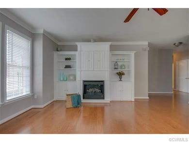 The lovely built-in bookcase includes a TV alcove,