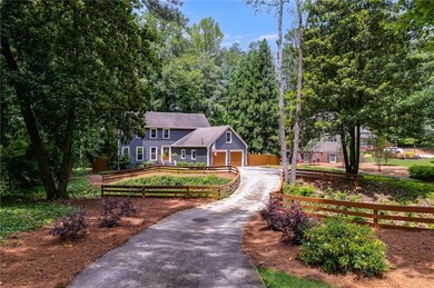 Colonial home with asphalt driveway