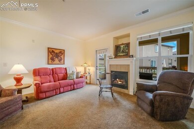 Living room with patio access and gas fireplace
