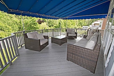 Wine down with friends on the shaded deck.